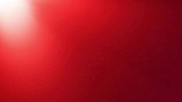 Abstract red background with diagonal light flare