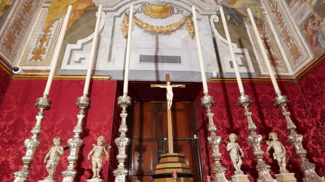 private chapel altar grand master's palace valletta silver candlesticks flanking wooden crucifix red damask wall hangings frescoed vault knights of malta religious order chapel interior malta