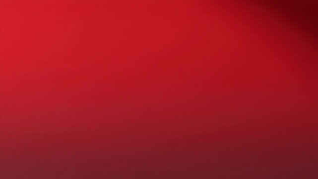 Blurred red background with soft light transitions