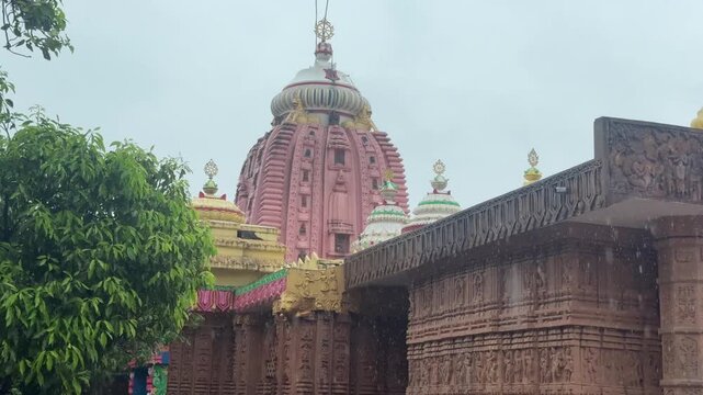 Ancient Hindu Temple Shikhara in Monsoon Rain with Ornate Stone Architecture

