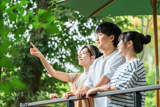 A group of men and women refreshing themselves in nature during holidays and summer vacation.