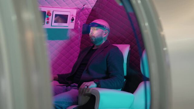 Futuristic hyperbaric oxygen therapy session in a pressure chamber with a man wearing a VR headset and a nasal cannula, experiencing an innovative wellness treatment for health and relaxation