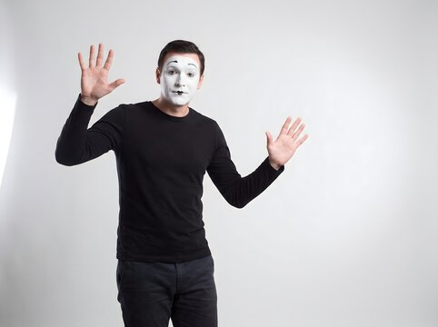 Mime Performer Making Invisible Wall Gesture with Hands