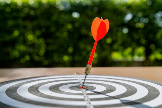 Dart in bullseye of dartboard, concept for business target planning growth and aim to winner goal.