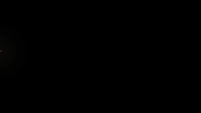 Lens flare produces a faint glow on a black background.