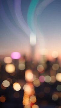 A Serene Cityscape at Dusk: An Abstract Bokeh Effect Emphasizing Lights and Buildings as Day Transitions to Night in a Vibrant Urban Environment
