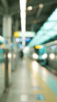 A Blurry Scene at the Train Station Platform Capturing the Motion and Ambiance of Urban Travel with a Focus on the Movement of Commuters