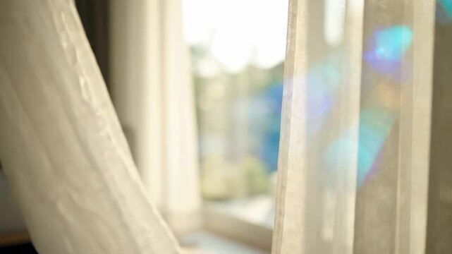 soft light filtering through sheer curtains, creating colorful lens flares and bokeh, serene indoor atmosphere, abstract background blur
