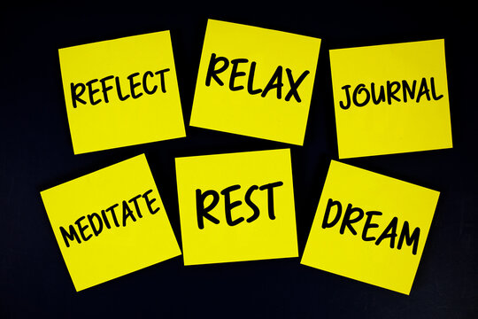 Reflect, Relax, Journal, Meditate, Rest, Dream message written on paper notes Evening Routine concept