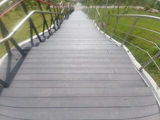 Obraz premium Grey Plastic Wooden Staircase in Park