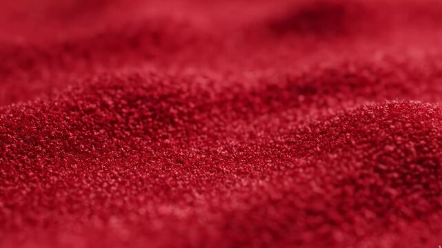 Close up of red carpet texture with soft focus and fabric detail