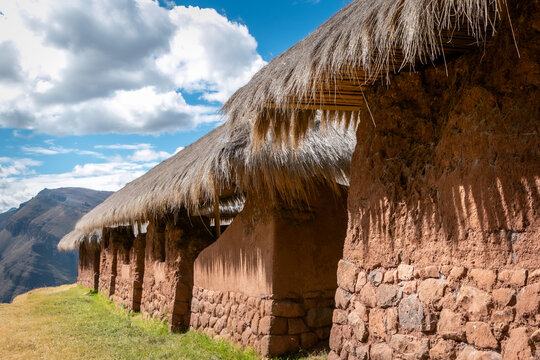 Traditional Inca adobe buildings with thatched roofs at Huchuy Qosqo, Peru