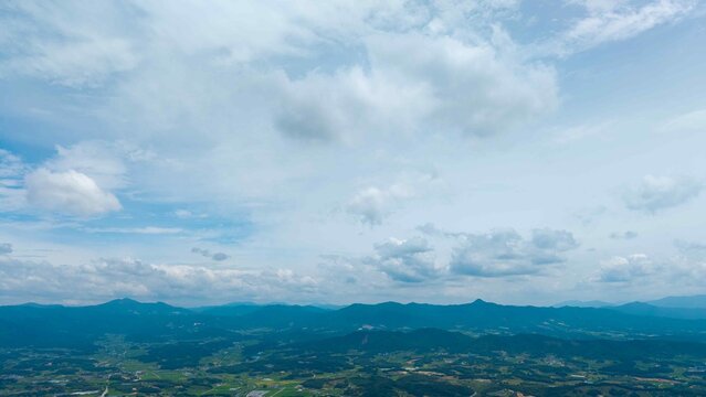 July blue sky and clouds photographed by drone near a highway rest area in rural Korea