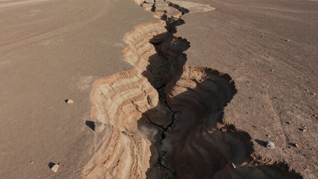 Earth Crack in Dry Landscape Showcasing Geological Formation Process