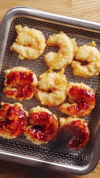 Brush coats fried shrimp with spicy red sauce. Top cucumber, cabbage or noodle salad with spicy shrimp for protein and heat. Spicy shrimp salad pairs with sesame, spring onion, avocado, lime or herbs.