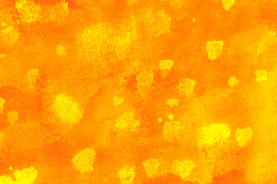 Abstract orange and yellow painted texture with bright mottled areas and expressive color variations, creating a warm energetic background for creative designs, posters, packaging and digital artwork.