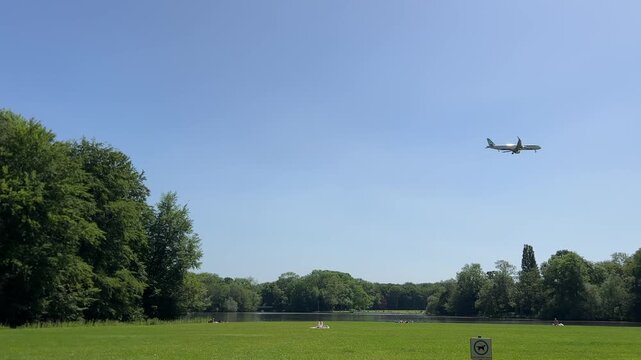 Aircraft flying over Amsterdam Forest park near Schiphol Airport, Netherlands Aircraft flying over Amsterdam Forest