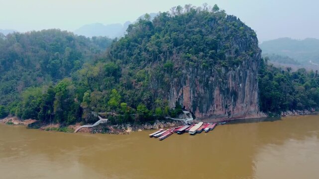Aerial View of Pak Ou Caves and Mekong River with Traditional Tourist Boats, Luang Prabang, Laos