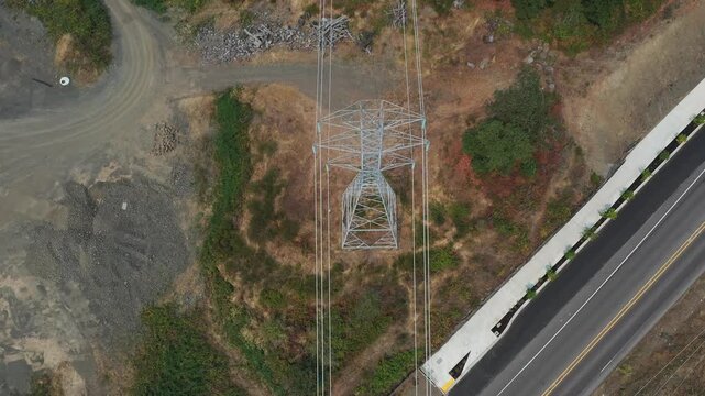 4K aerial drone footage of high voltage power transmission lines leading toward smoky Sherwood, Oregon, USA under heavy smoke from active summer wildfires, highlighting electrical tower infrastructure