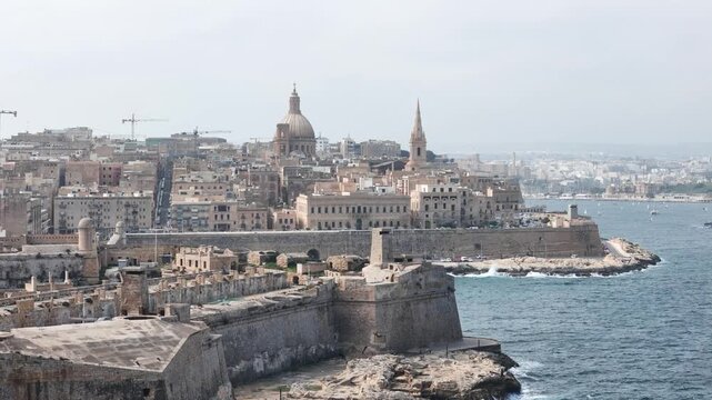 fort st elmo aerial view breakwater close valletta malta overcast sky rough sea grand harbour coastal fortification peninsula limestone rampart drone internationally recognized heritage site