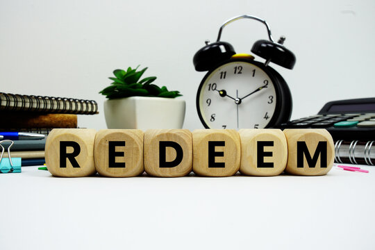 REDEEM alphabet letters with alarm clock and calculator on white background