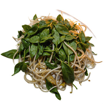 Hanoi Pho Herbs Piled plate of bean sprouts and Thai basil at street stall overhead shot under paper lantern glow