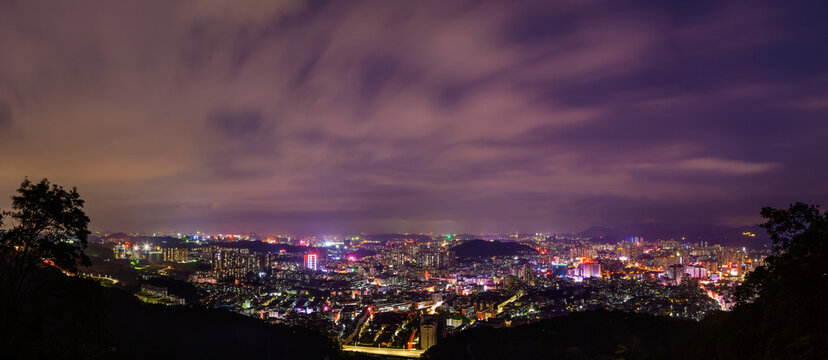 Night City Lights Panorama Over Urban Skyline at Dusk