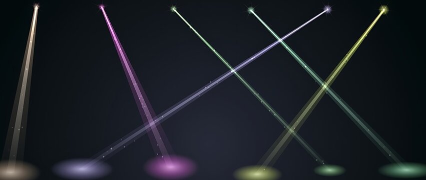 Vertical stage spotlights with colorful light beams crossing on dark background