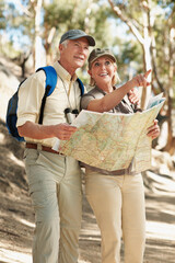 Naklejka premium Senior, couple and map in forest for hiking, trail direction or point to backpacking destination. Marriage, happy people and paper guide for trekking journey, route planning and explore in retirement
