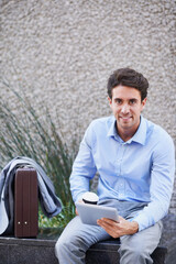 Obraz premium Portrait, business and man in city on tablet for research, property listing and real estate. Corporate, realtor and person on tech for planning, commercial investment and website on coffee break