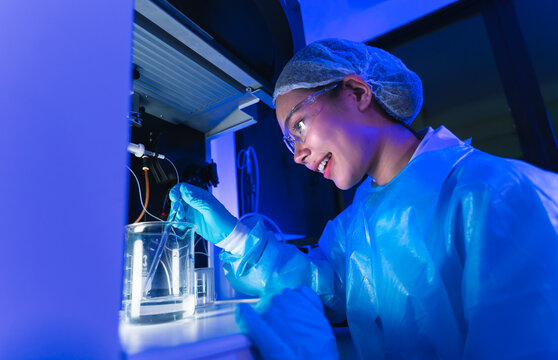 Scientist conducting medical research in laboratory innovative experiments controlled environment close-up perspective