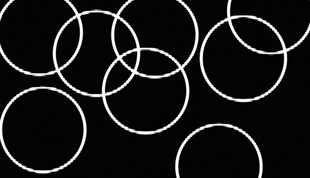 Abstract pattern of overlapping white circles on black background