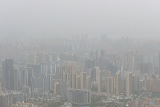 Wuhan Skyline Looms Through Dust and Smog Haze