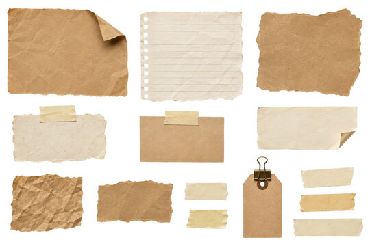 Vintage kraft paper scraps, torn notebook sheets, masking tape, curled paper notes and a blank kraft tag with binder clip arranged as a clean flat lay collection isolated on a pure white background.