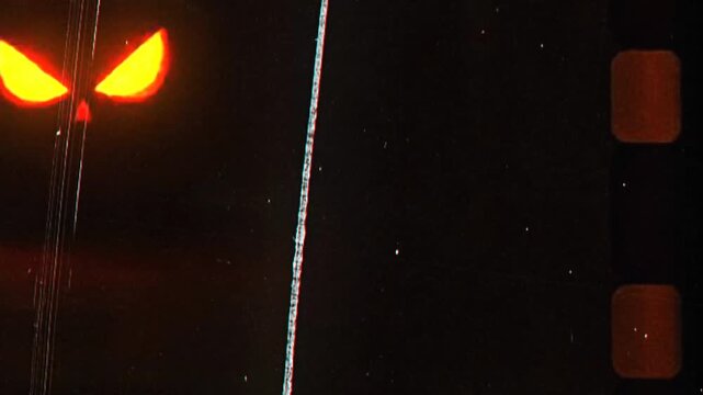 Glowing demonic eyes in dark horror scene with eerie red orange light transition reflection