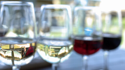 Obraz premium Close Up of Red and White Wine Flight on Outdoor Table