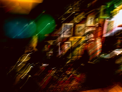 Abstract Blurred Motion Interior Shot with Light Trails and Vintage Art Wall Decoration