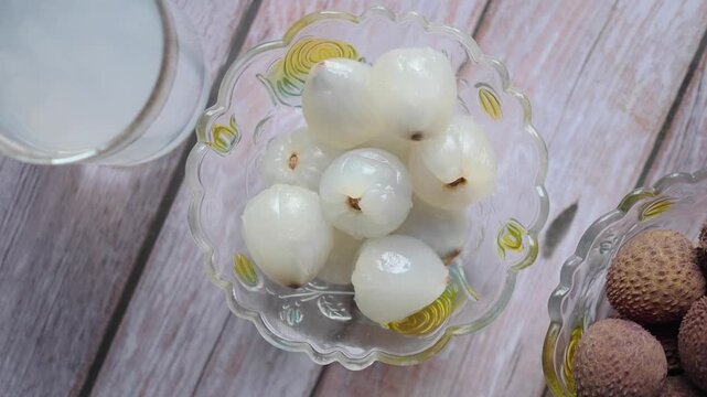 Enjoying lychee and longan fruit snacks on a table
