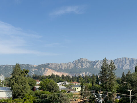 Power Lines Over a Residential Area with Mountains