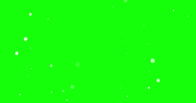 Soft white particle bokeh bubbles floating on green screen gentle of glowing or dust particles drifting upwards against a bright background particles glowing background chroma key