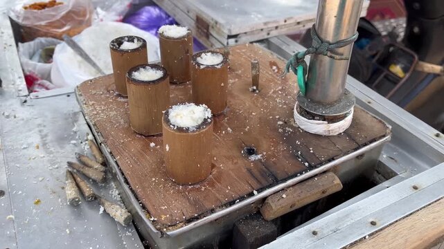 Traditional Indonesian Putu Cake Steaming Process on Bamboo Tubes
