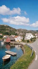Fototapeta premium Scenic coastal village with colorful houses and clear water mobile wallpaper.