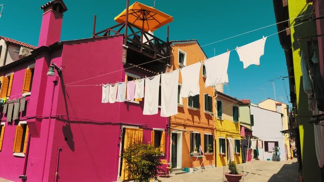 Burano laundry strung above vivid colorful houses