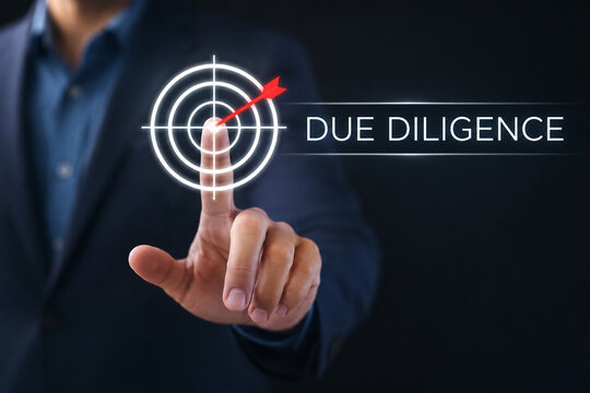Business hand clicking due diligence button on touch screen 
