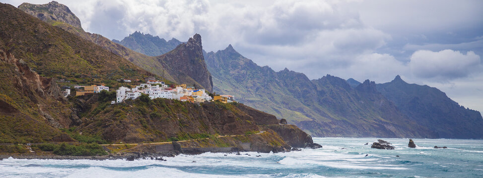 Almaciga village on cliffs by ocean in Anaga mountains Tenerife, Canary islands landscape with copy space