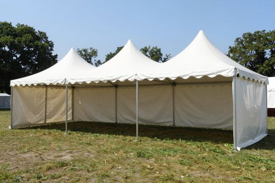 Two White Event Tents on Green Lawn