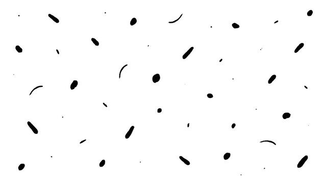 Scattered black ink dots and short dashes on a white background