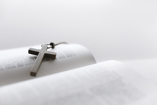 The cross of Jesus Christ placed on the holy Bible, God's word of life
