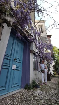 Woman stroll through the old streets of Istanbul with a view of the Bosphorus. Beautiful narrow streets with a rich cultural heritage.