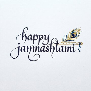 Handwritten Happy Janmashtami calligraphic text with golden peacock feather and flute on white textured paper, festive greeting concept, krishna janmashtami calligraphy.